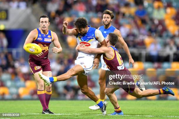 Jarrod Harbrow of the Suns gets a kicks away during the round five AFL match between the Brisbane Lions and the Gold Coast Suns at The Gabba on April...