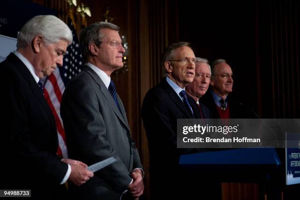 Senators Chris Dodd , Max Baucus , Senate Majority Leader Harry Reid , American Medical Association president-elect Cecil B. Wilson, and Sen. Tom...