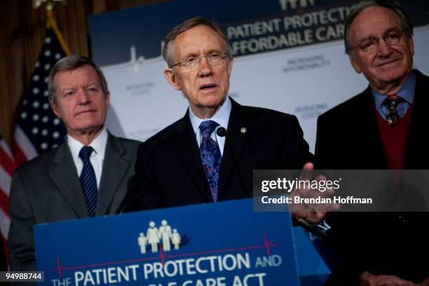 Sen. Max Baucus , Senate Majority Leader Harry Reid , and Sen. Tom Harkin speak at a news conference on health insurance reform legislation on...