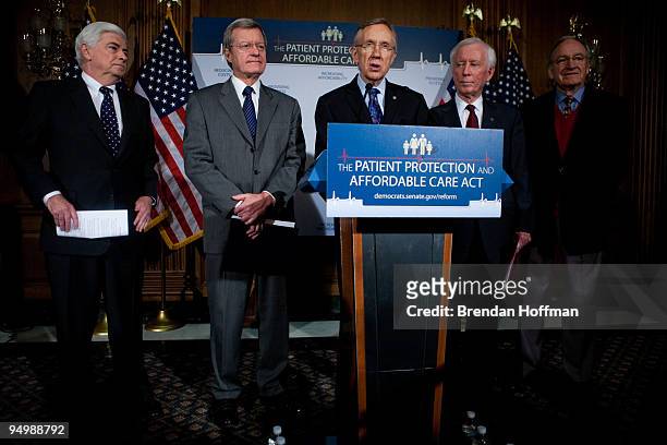 Senators Chris Dodd , Max Baucus , Senate Majority Leader Harry Reid , American Medical Association president-elect Cecil B. Wilson, and Sen. Tom...