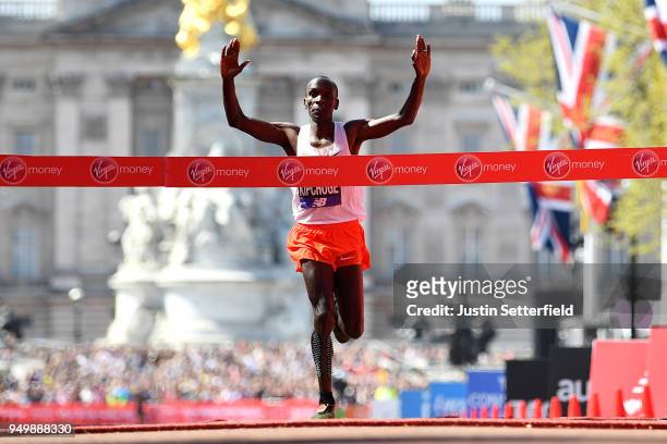 Eliud Kipchoge of Kenya crosses the finish line to take first place during the Virgin Money London Marathon at United Kingdom on April 22, 2018 in...