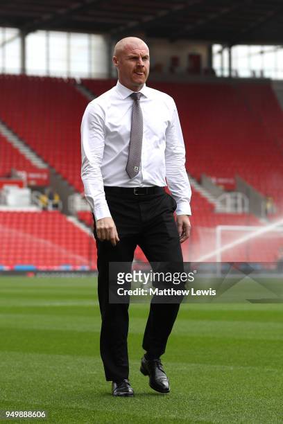 Sean Dyche, Manager of Burnley inspects the pitch ahead of the Premier League match between Stoke City and Burnley at Bet365 Stadium on April 22,...