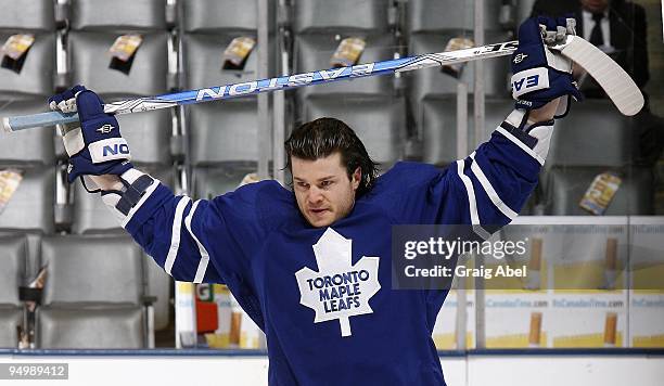 Garnet Exelby of the Toronto Maple Leafs stretches during warm up prior to the game against the Phoenix Coyotes on December 16, 2009 at the Air...