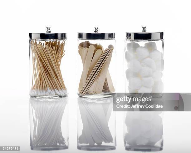 apothecary jars with medical supplies - coton tige photos et images de collection