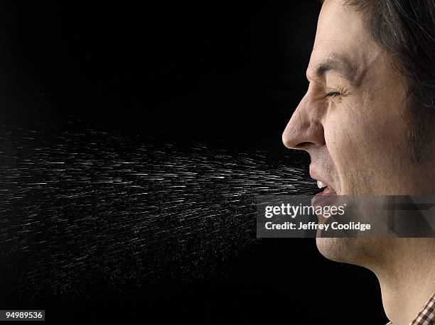man sneezing - saliva substância orgânica imagens e fotografias de stock
