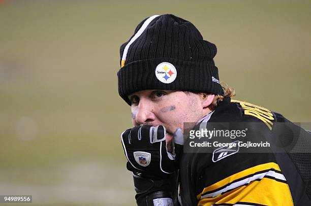 Quarterback Ben Roethlisberger of the Pittsburgh Steelers looks on from the sideline as officials review a challenge to a last second touchdown by...