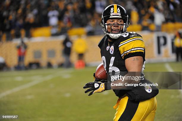 Wide receiver Hines Ward of the Pittsburgh Steelers runs with the football after catching a pass during a game against the Green Bay Packers at Heinz...