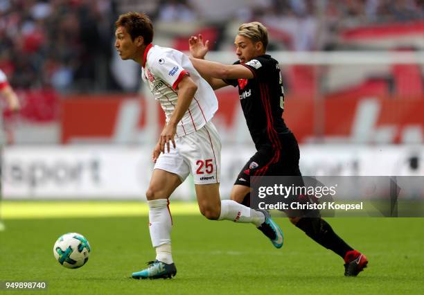 Thomas Pledl of Ingolstadt challenges Genki Haraguchi of Duesseldorf during the Second Bundesliga match between Fortuna Duesseldorf and FC Ingolstadt...