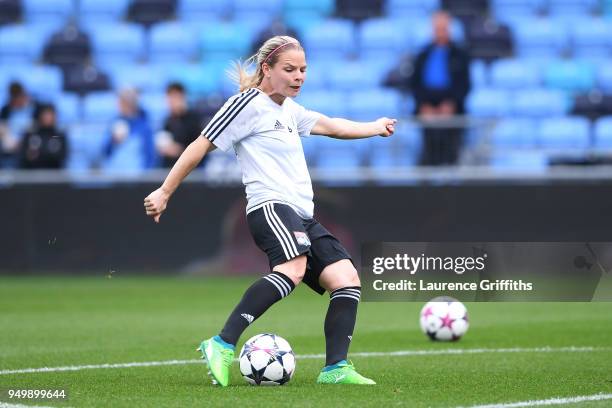 Eugenie Le Sommer of Lyon takes a shot during warm up ahead of the UEFA Women's Champions League Semi Final: First Leg match between Manchester City...