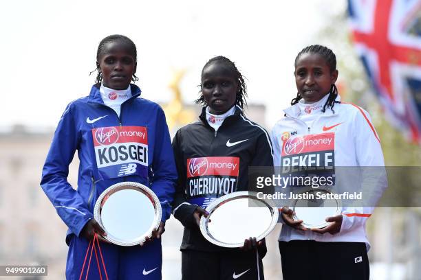 Second placed Brigid Kosgei of Kenya, winner Vivian Cheruiyot of Kenya and third placed Tadelech Bekele of Ethiopia pose with their trophies...