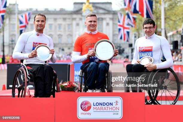 Second placed Marcel Hug of Switzerland, winner David Weir of Great Britain and third placed Daniel Romanchuk of the United States pose with their...