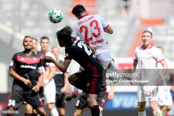 Niko Giesselmann of Duesseldorf scores the second goal against Christian Traesch of Ingolstadt during the Second Bundesliga match between Fortuna...