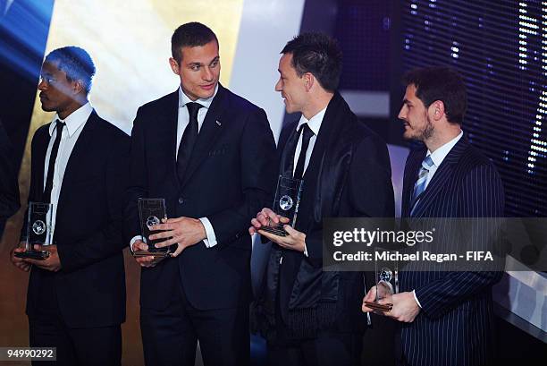 John Terry chats with Nemanja Vidic as Patrice Evra and Iker Casillas look on after collecting their FIFA World XI Player Awards during the FIFA...