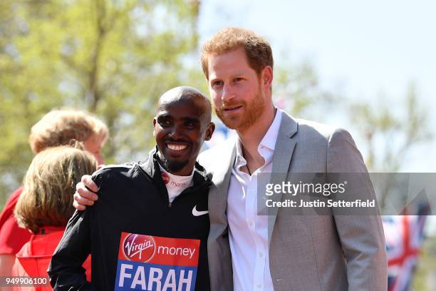 Mo Farah of Great Britain poses with HRH Prince Harry following the Virgin Money London Marathon at United Kingdom on April 22, 2018 in London,...