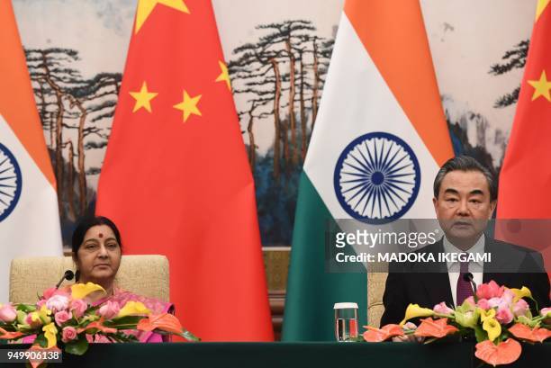 India's Foreign Minister Sushma Swaraj and China's Foreign Minister Wang Yi chair a press conference after their meeting at the Diaoyutai State Guest...