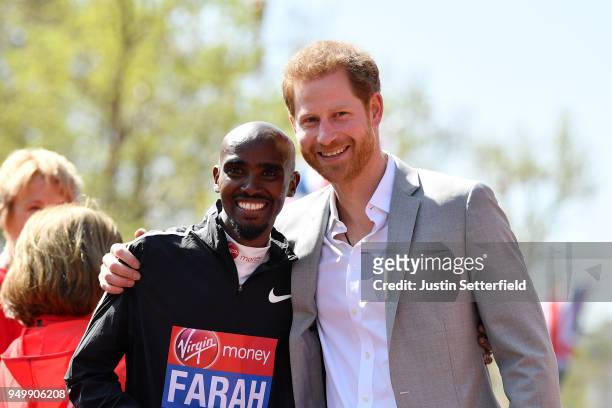 Mo Farah of Great Britain poses with HRH Prince Harry following the Virgin Money London Marathon at United Kingdom on April 22, 2018 in London,...