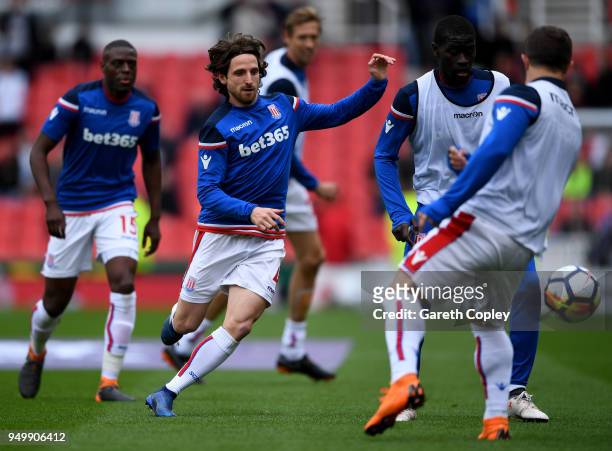 Joe Allen of Stoke City warms up prior to the Premier League match between Stoke City and Burnley at Bet365 Stadium on April 22, 2018 in Stoke on...