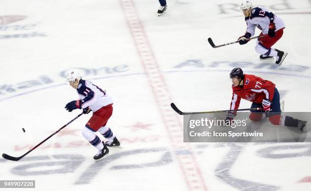 Washington Capitals right wing T.J. Oshie watches as Columbus Blue Jackets left wing Matt Calvert goes on goal in a breakaway to score for Columbus...