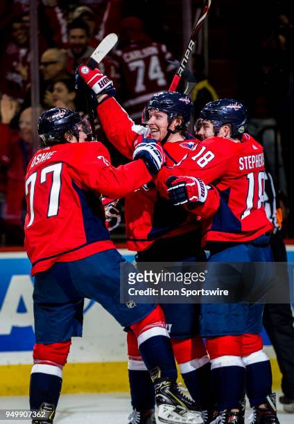Washington Capitals right wing T.J. Oshie and center Chandler Stephenson surround center Nicklas Backstrom after his game winning goal during the...