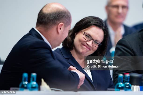 Andrea Nahles shakes hands with Olaf Scholz at a federal party congress of the German Social Democrats following her election as new party leader on...