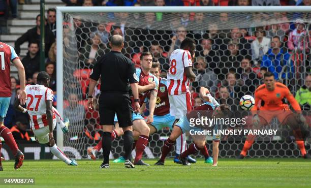 Stoke City's Senegalese defender Badou Ndiaye scores the opening goal during the English Premier League football match between Stoke City and Burnley...