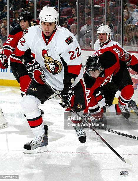 Chris Kelly of the Ottawa Senators plays the puck against the New Jersey Devils during their game at the Prudential Center on December 18, 2009 in...