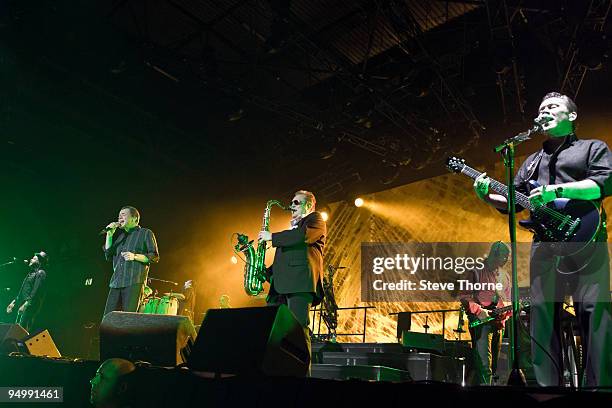 Astro, Duncan Campbell, Brian Travers and Robin Campbell of UB40 perform on stage at LG Arena on December 21, 2009 in Birmingham, England.