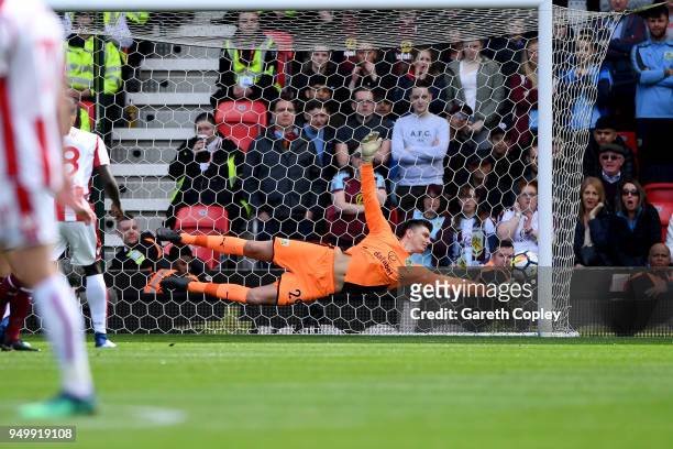 Badou Ndiaye of Stoke City scores his side's first goal past Nick Pope of Burnley during the Premier League match between Stoke City and Burnley at...