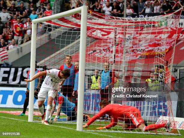 Robin Bormuth of Duesseldorf scores the third goal against Oerjan Nyland of Ingolstadt during the Second Bundesliga match between Fortuna Duesseldorf...