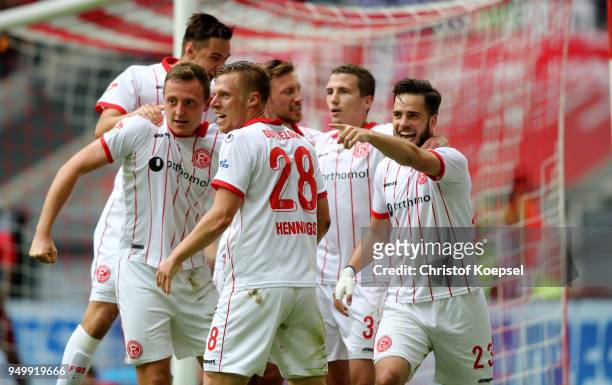 Robin Bormuth of Duesseldorf celebrates the third goal with his team mates during the Second Bundesliga match between Fortuna Duesseldorf and FC...