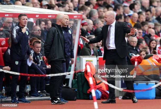 Sean Dyche, Manager of Burnley speaks with fourth official during the Premier League match between Stoke City and Burnley at Bet365 Stadium on April...