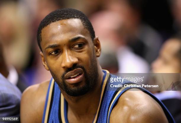 Gilbert Arenas of the Washington Wizards sits on the bench during the NBA game against the Phoenix Suns at US Airways Center on December 19, 2009 in...