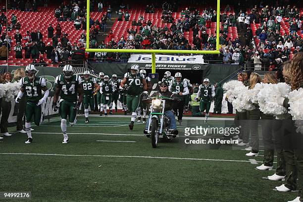 Founder of the Orange County Choppers Paul Teutul, Sr. Leads the New York Jets out on the field before the game between the Atlanta Falcons and New...