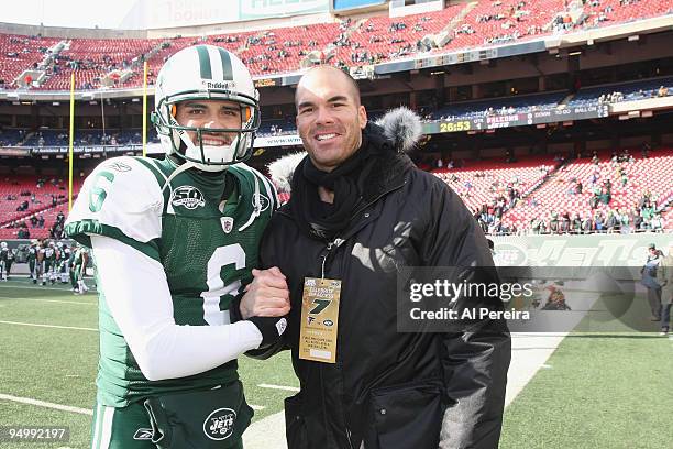 Actor Brandon Molale meets Quarterback Mark Sanchez of the New York Jets sideline before the game between the Atlanta Falcons and New York Jets game...