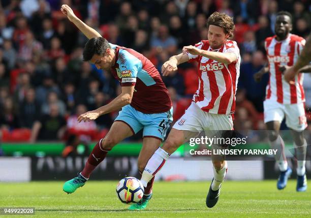 Burnley's English midfielder Jack Cork vies with Stoke City's Welsh midfielder Joe Allen during the English Premier League football match between...