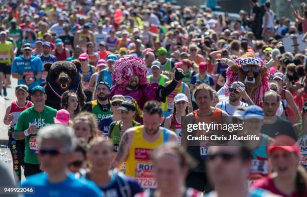 Runners cross over Tower Bridge during the London Marathon at United Kingdom on April 22, 2018 in London, England. 40,000 runners are taking part in...