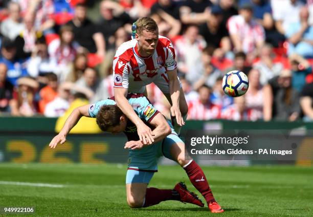 Burnley's Ashley Barnes and Stoke City's Ryan Shawcross battle for the ball during the Premier League match at the bet365 Stadium, Stoke.