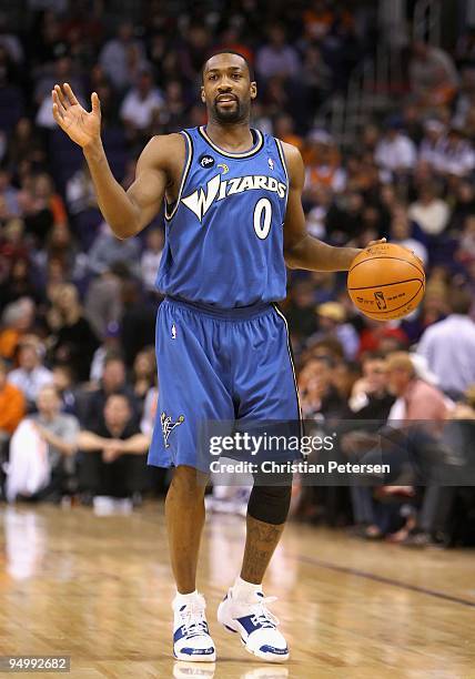Gilbert Arenas of the Washington Wizards hanldles the ball during the NBA game against the Phoenix Suns at US Airways Center on December 19, 2009 in...