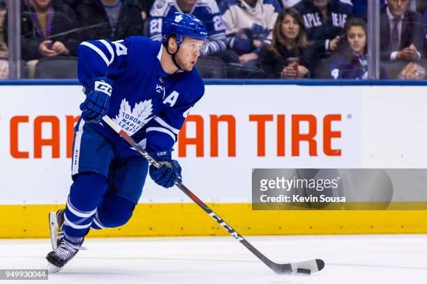 Morgan Rielly of the Toronto Maple Leafs skates with the puck against the Boston Bruins in Game Four of the Eastern Conference First Round during the...