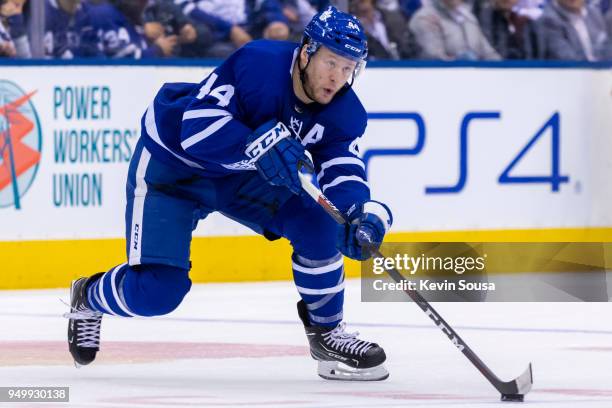 Morgan Rielly of the Toronto Maple Leafs skates with the puck against the Boston Bruins in Game Four of the Eastern Conference First Round during the...