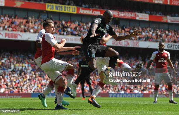 Angelo Ogbonna of West Ham United jumps for the ball during the Premier League match between Arsenal and West Ham United at Emirates Stadium on April...