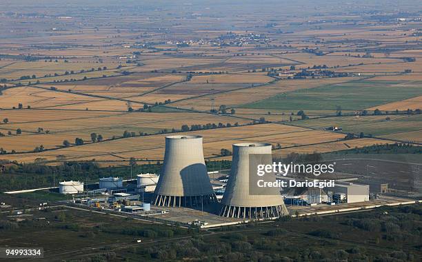 aerial view of a dismissed nuclear power plant among fields - nuclear reactor stock pictures, royalty-free photos & images