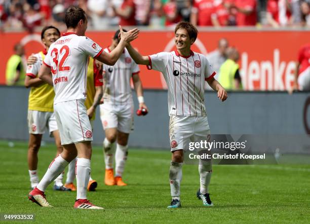 Robin Bormuth and Genki Haraguchi of Duesseldorf celebrate after the Second Bundesliga match between Fortuna Duesseldorf and FC Ingolstadt 04 at...