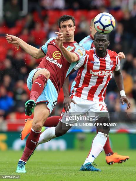 Burnley's English midfielder Jack Cork vies with Stoke City's Senegalese defender Badou Ndiaye during the English Premier League football match...