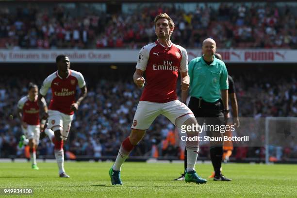 Nacho Monreal of Arsenal celebrates scoring his side's first goal during the Premier League match between Arsenal and West Ham United at Emirates...
