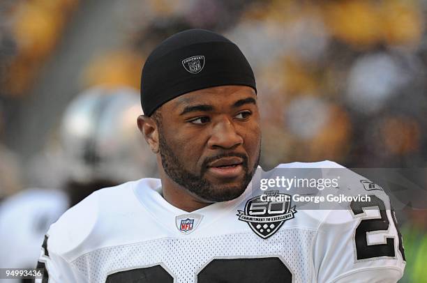 Cornerback Stanford Routt of the Oakland Raiders looks on from the field during a game against the Pittsburgh Steelers at Heinz Field on December 6,...