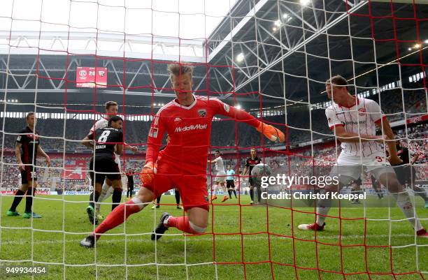 Robin Bormuth of Duesseldorf scores the third goal against Oerjan Nyland of Ingolstadt during the Second Bundesliga match between Fortuna Duesseldorf...