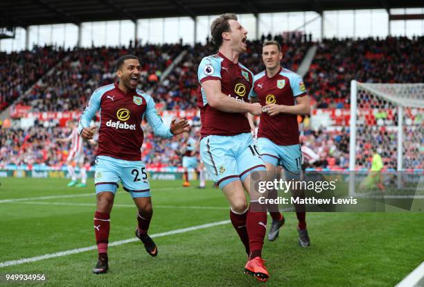 Ashley Barnes of Burnley celebrates scoring his side's first goal with Aaron Lennon and Chris Wood during the Premier League match between Stoke City...