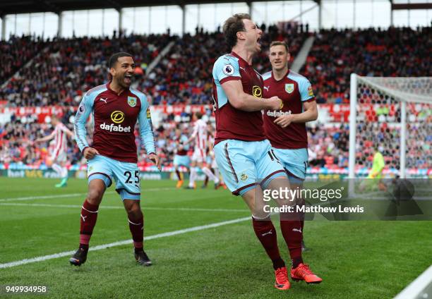 Ashley Barnes of Burnley celebrates scoring his side's first goal with Aaron Lennon and Chris Wood during the Premier League match between Stoke City...