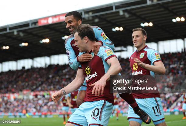 Ashley Barnes of Burnley celebrates scoring his side's first goal with Aaron Lennon and Chris Wood during the Premier League match between Stoke City...